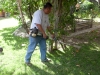 Worker Edging/Cutting Weed with a Weed Whacker